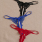 Tanga con abertura y perlas